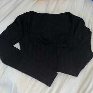 Long sleeve black crop top.